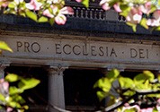 The words "Pro Ecclesia Dei" appear on the frieze of Low Memorial Library