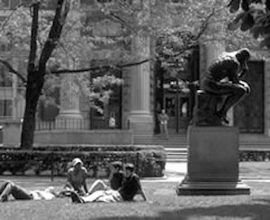students relaxing on lawn