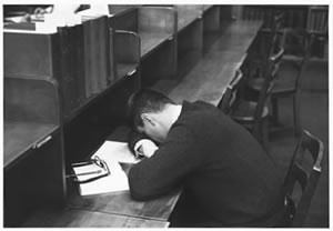 student sleeping in library